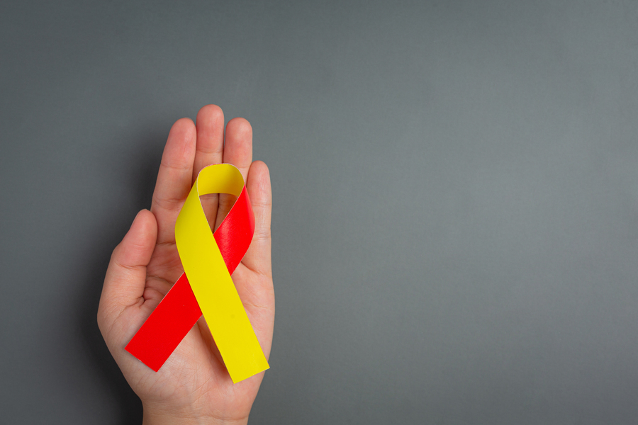 world-hepatitis-day-awareness-with-red-yellow-ribbon.jpg