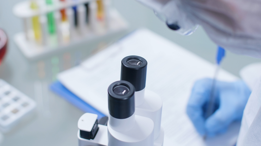 closeup-scientist-researcher-doctor-writing-medical-expertise-clipboard-working-biochemistry-experiment-microbiology-hospital-laboratory-chemist-man-developing-vaccine-against-covid19.jpg